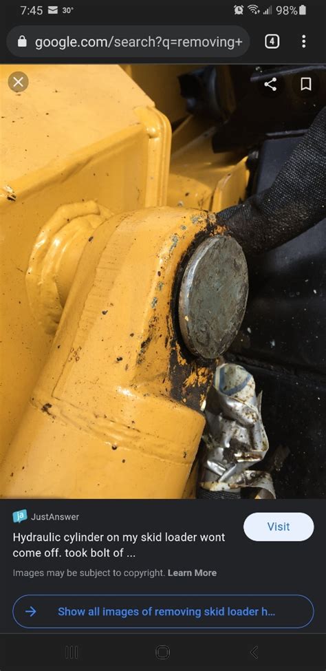 john deere skid steer bucket pin removal|tapered pin removal john deere.